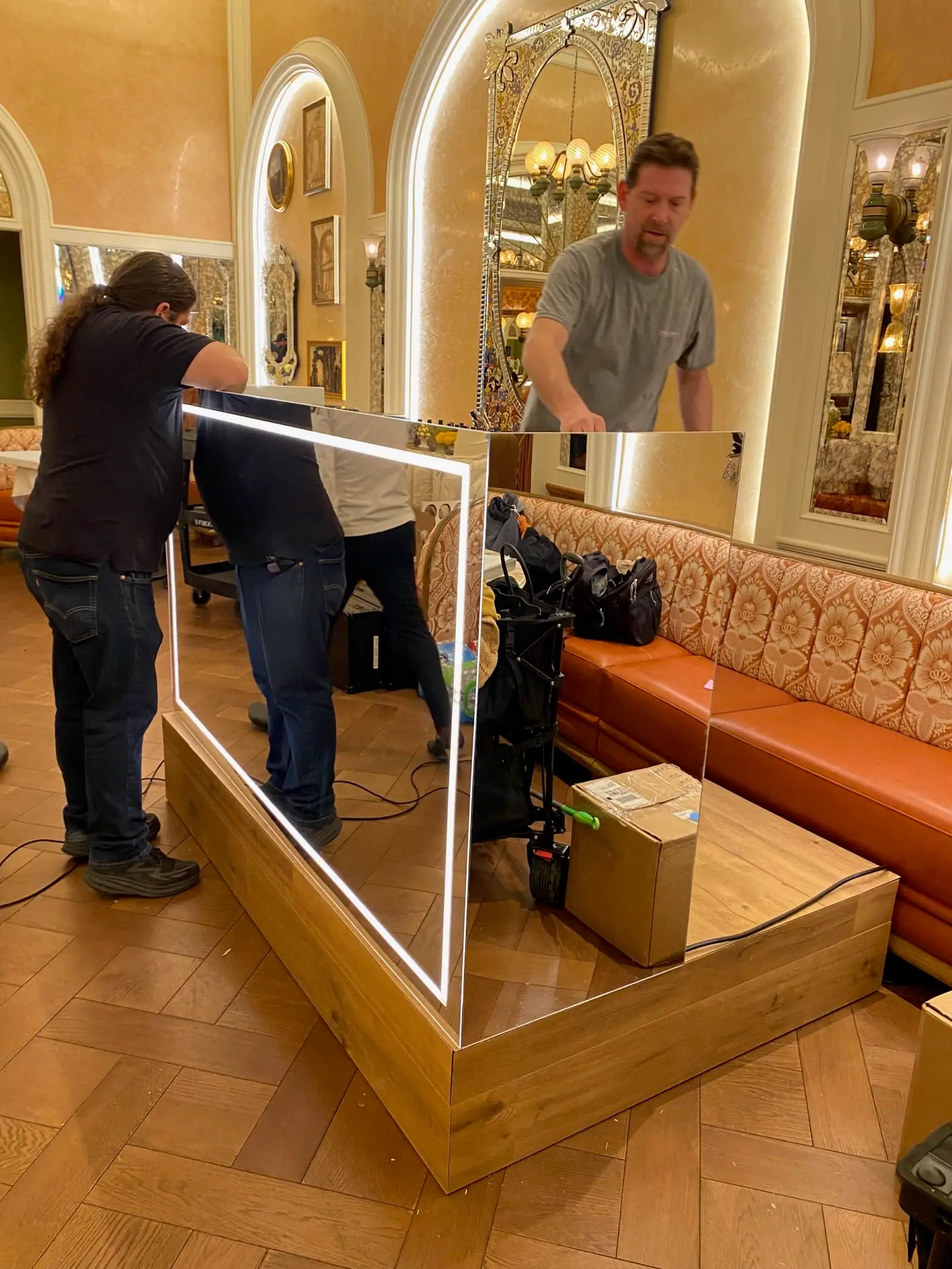 Crew installing LED display panel at venue